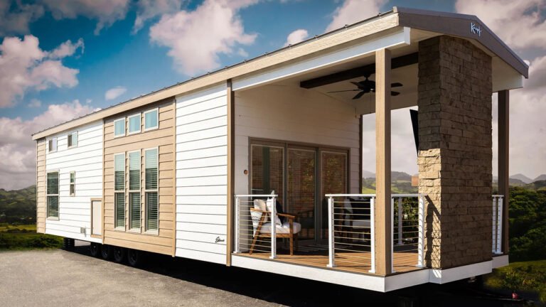This Park Model Tiny House Puts 36-Inch Stone Fireplace on Porch