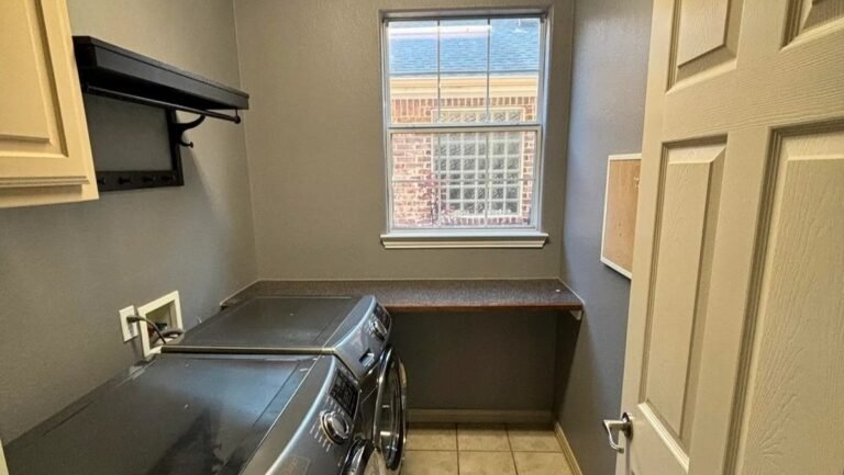 They Raised the Washer and Dryer Off the Floor and Built Storage Around Them