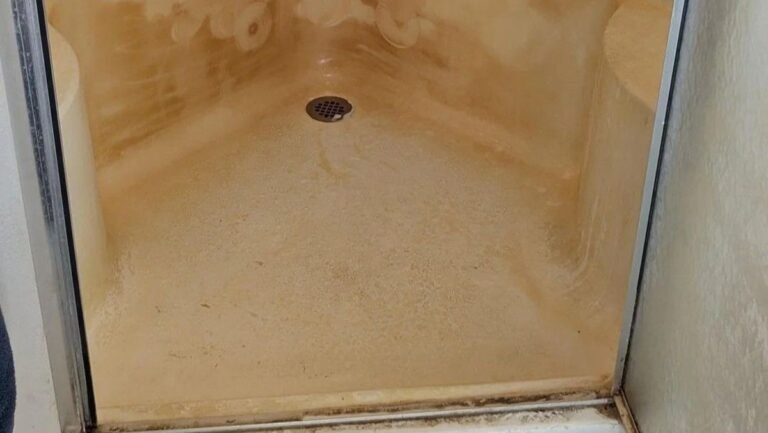 This Shower Looked Permanently Yellow Until 90 Minutes of Cleaning Revealed Its Original Color