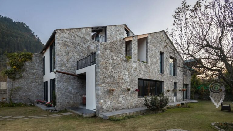 Salt Box Stone-Clad Home in Orchards Echoes Stillness of Mountains